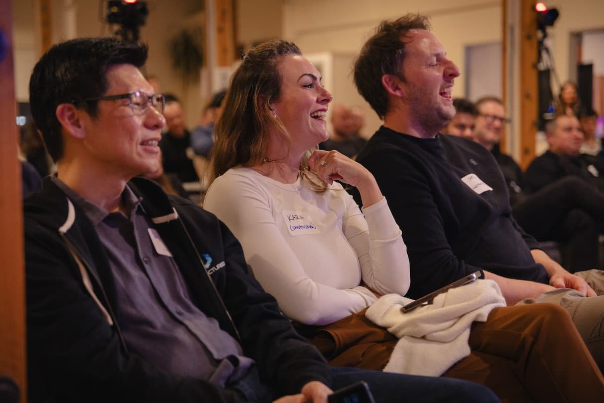 The audience laughing during a Thursday Nights in AI fireside chat